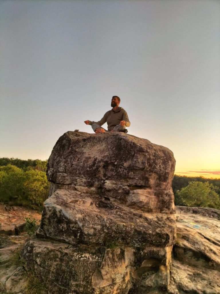 Codie Meditating on a rock